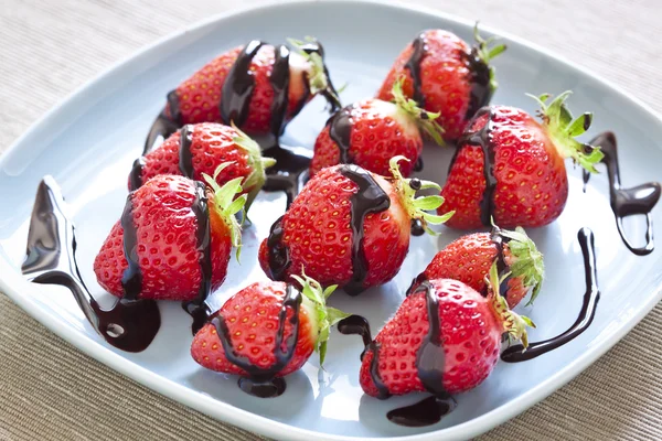 Fresh strawberries and  dark chocolate — Stock Photo, Image