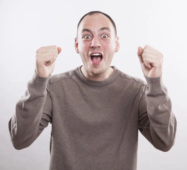 Portrait of a winner young man on white background — Stock Photo, Image