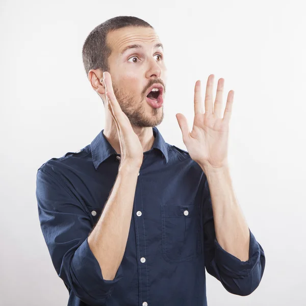 Young man calling, screaming good news — Stock Photo, Image