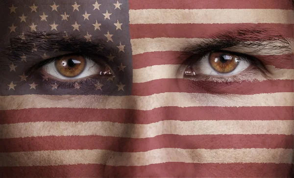 Usa, american flag painted on the face of young man Royalty Free Stock Images