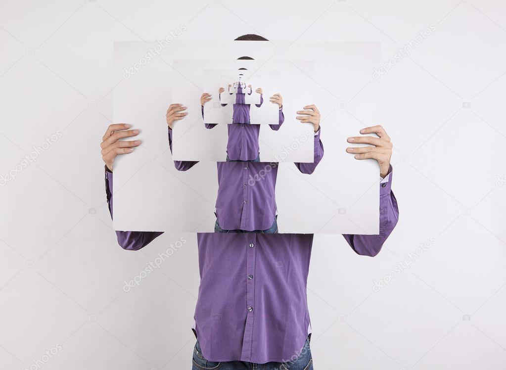 man holding picture of himself to infinity
