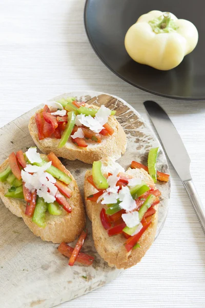 Crostini with red and green pepper — Stock Photo, Image