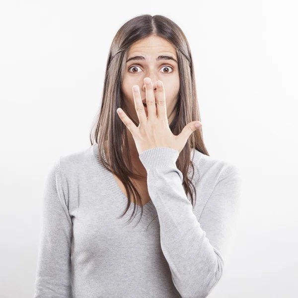 Young beautiful woman surprised face expression — Stock Photo, Image