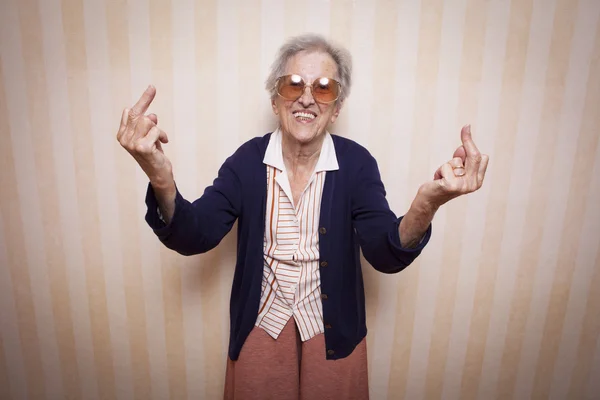 Lady making middle fingers signs — Stock Photo, Image