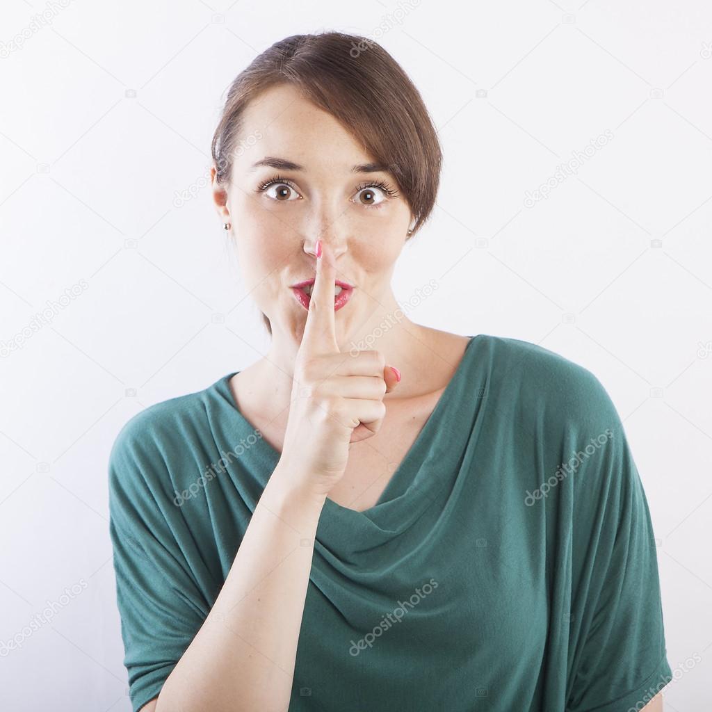 woman doing silence gesture