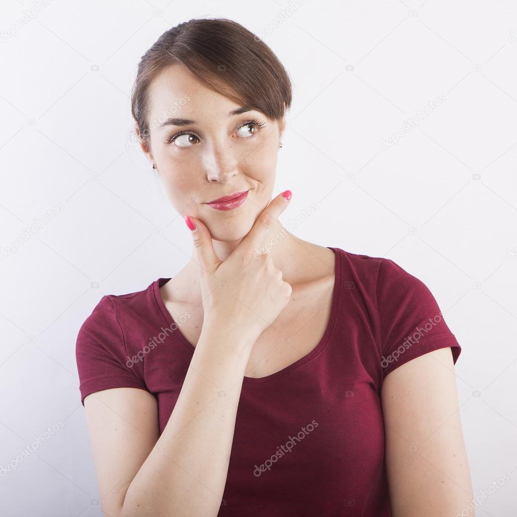 woman thinking with hand on chin