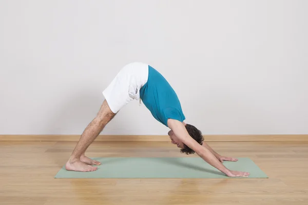 man practicing pilates