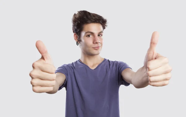 Young man with thums up — Stock Photo, Image