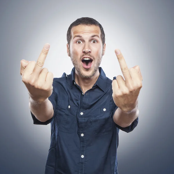 Young man showing middle fingers Stock Image