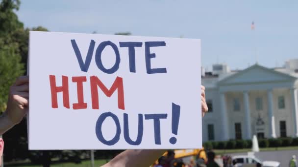 Man Holds Vote Him Out Protest Sign — Stock Video