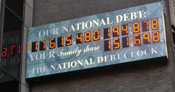 NEW YORK CITY - Circa July, 2014 - A summer establishing shot of the U.S. National Debt Clock counting up in Manhattan, New York. — Stock Video