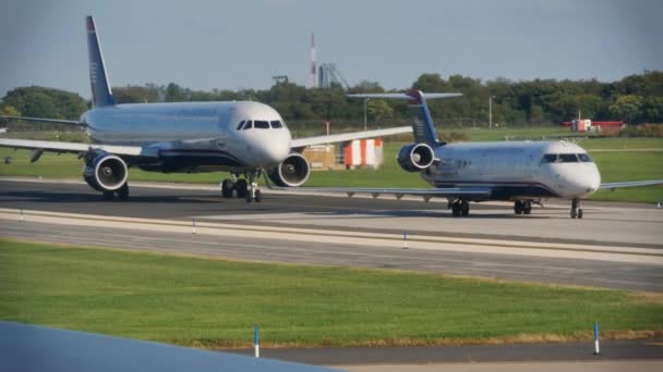 USAirways jetliners line up and wait for takeoff. — Stock Video