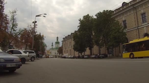 UKRAINE - Circa August, 2015 - Traffic near the National Kyiv-Pechersk Historical and Cultural Preserve in Kyiv, Ukraine. — Stock Video