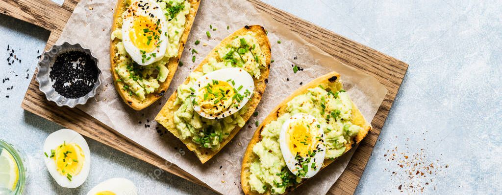 Mashed Avocado and Boiled Egg Toasts with Chives and Black Sesame Seeds, banner