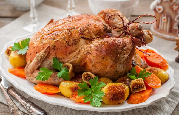 Christmas Stuffed Chicken Served with Potatoes, Carrots and Figs Stock Image