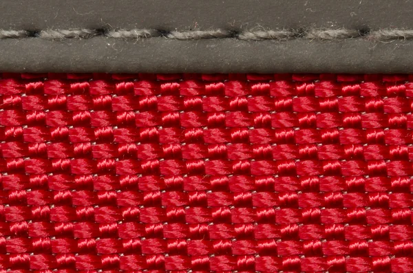 Textura de tela roja fondo con puntadas —  Fotos de Stock