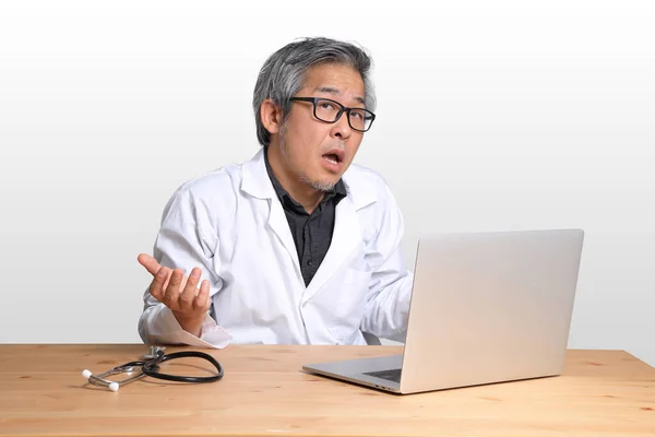 Senior Asian Physician Sitting Laptop — Stock Photo, Image