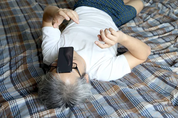 Asian Man Using Smart Phone Bed — Stock Photo, Image