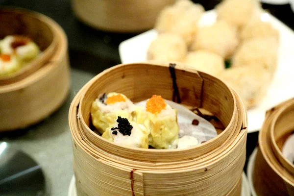 The Chinese dish called dim sum served on the table.