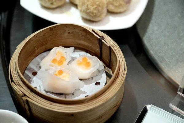 The Chinese dish called dim sum served on the table.