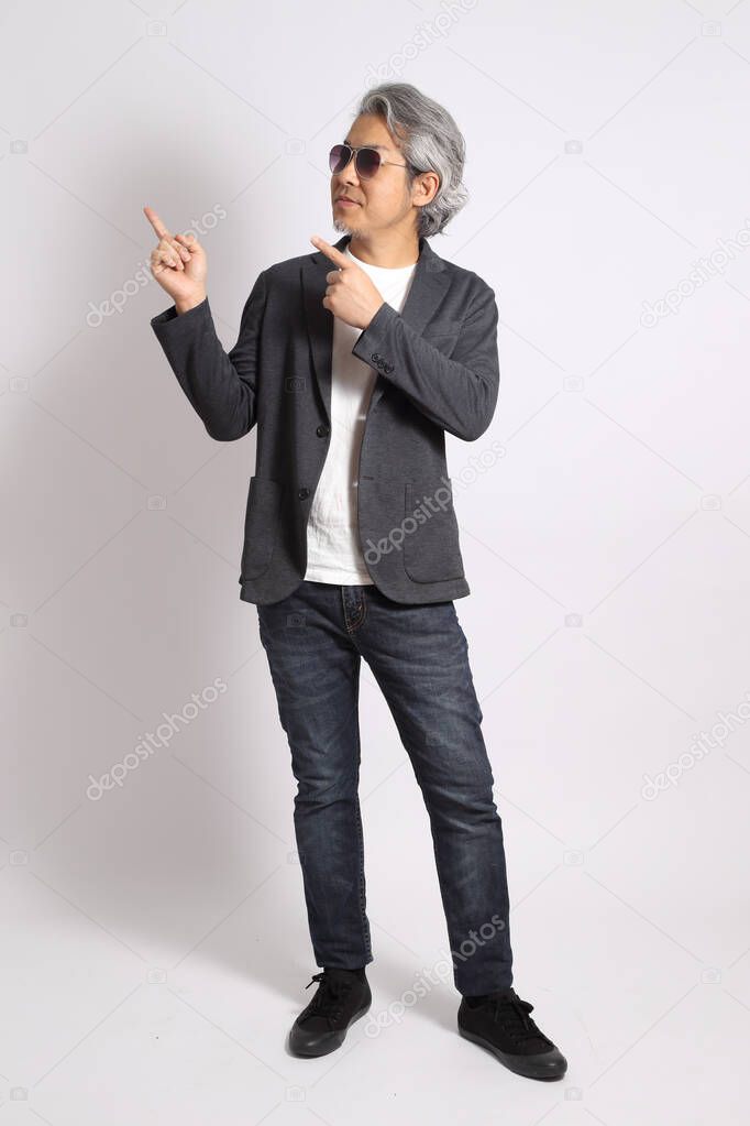 The adult Asian man on the white background.