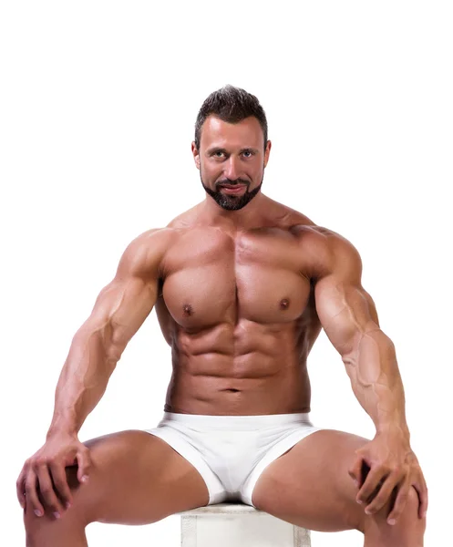 Kaslı adam beyaz izole iç çamaşırı