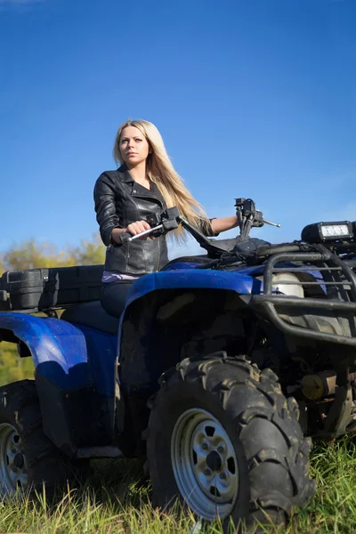 Elegant woman riding extreme quadrocycle ATV — Stock Photo, Image