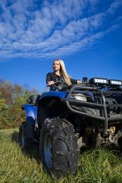 Elegant woman riding ATV — Stock Photo, Image