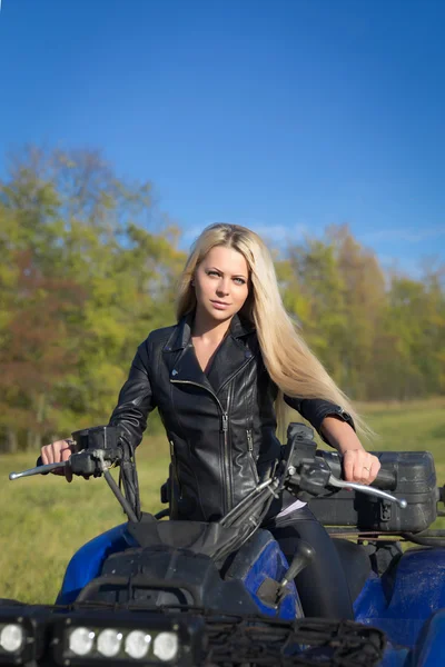 Elegant woman riding ATV — Stock Photo, Image