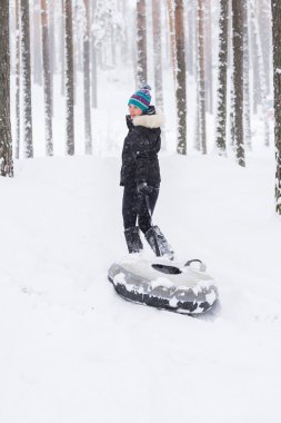 Woman outdoors at winter forest