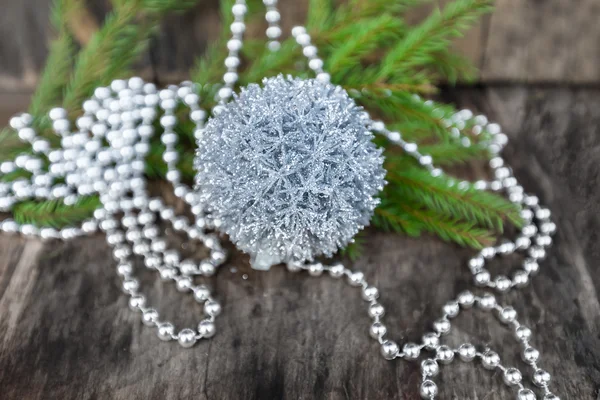 Silver Christmas ball on wooden background — Stock Photo, Image