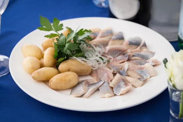 Portion of herring fish fillets with potato onion — Stock Photo, Image