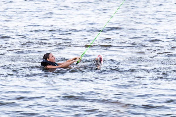 Woman study riding on a wakeboard — Stock Photo, Image