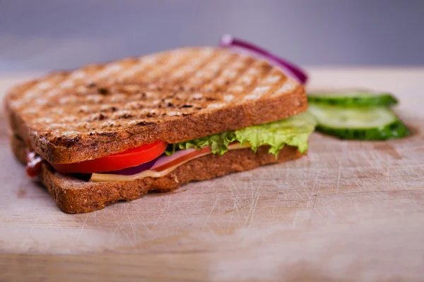 Fresh homemade grilled sandwich on wood — Stock Photo, Image