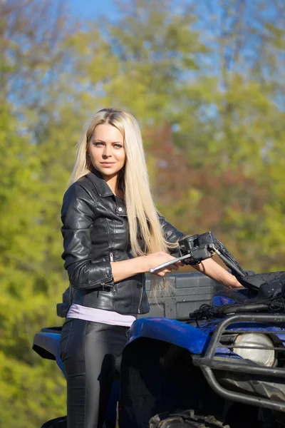 Elegant woman riding extreme quadrocycle ATV — Stock Photo, Image