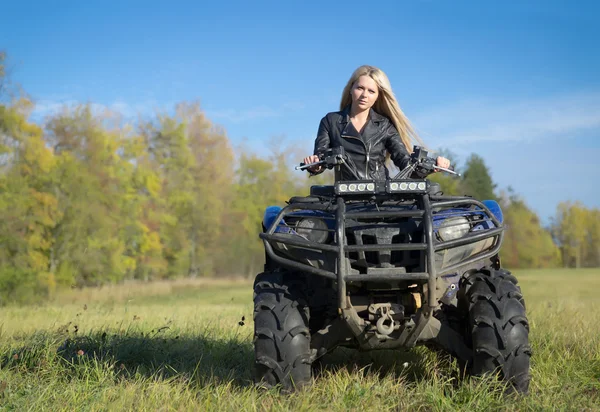 Elegant woman riding extreme quadrocycle ATV — Stock Photo, Image