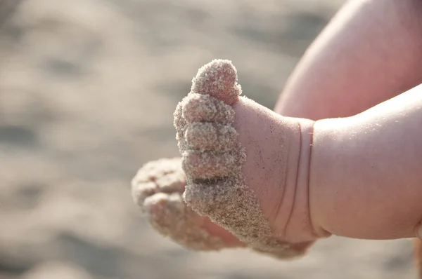 Sandstranden baby tår Stockfoto