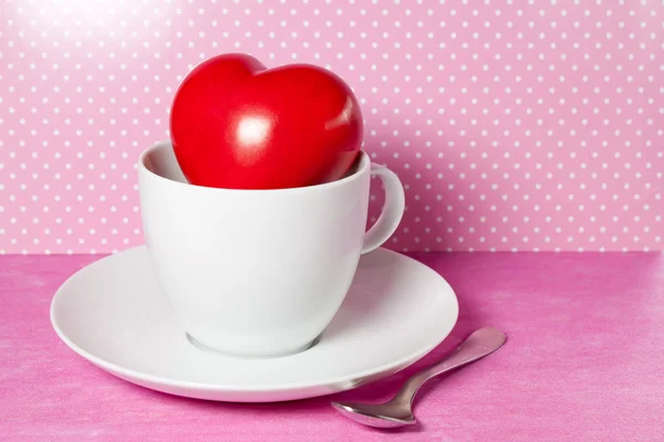 Red heart in a white cup — Stock Photo, Image