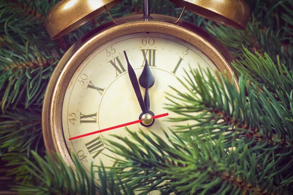 Christmas clock and fir branches — Stock Photo, Image