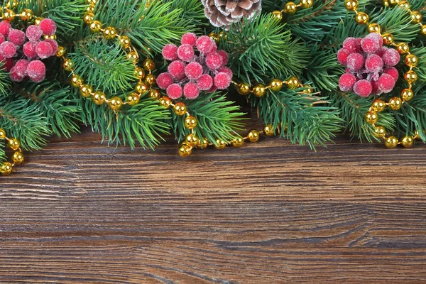 Christmas fir tree with decoration wooden background — Stock Photo, Image