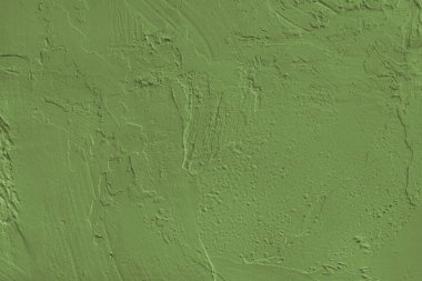 Yakından, haki rengi haki rengi makro desenli alçı, beton yüzey dokusu ile kaplanmış sıva. Soyut arkaplan, tasarım için arkaplan, duvar kağıdı sanatı veya dekorasyon projeleri.