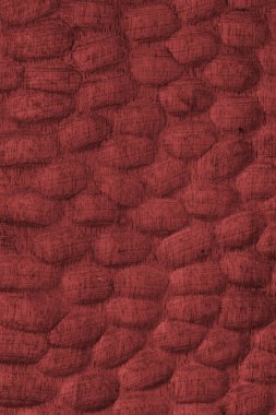 Kalıplı kırmızı ahşap yüzey oval desenler ve ahşap tahıllar. Tasarım, zanaat veya doğal doku ve materyal temaları için soyut doku arka planı ideali.