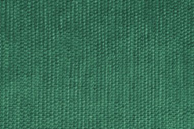 Yeşil döşeme kumaşı, detaylı dokuma desenli tekstil dokusu, yakın çekim, makro. İç tasarım, mobilya, duvar kağıtları, dekor, ambalaj ve yaratıcı arkaplanlar için kumaş arkaplan.