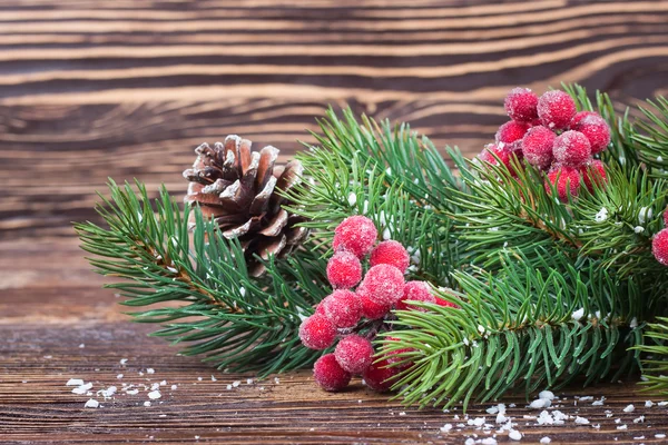 Christmas fir tree with decoration wooden background — Stock Photo, Image