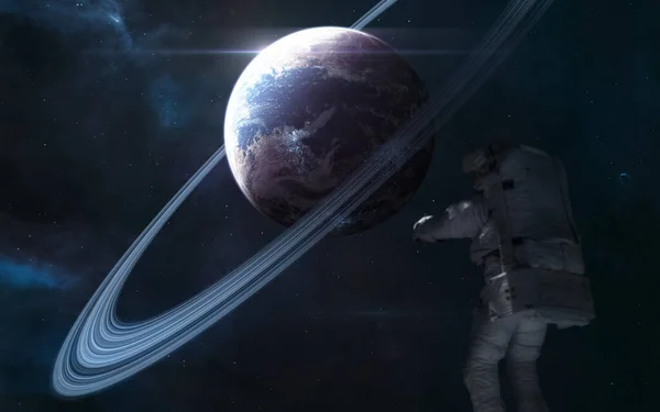Planeta en el espacio profundo. Astronauta fuera de foco —  Fotos de Stock