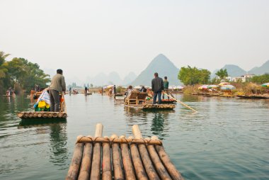 Bamboo rafting along YuLong, Guilin, China clipart