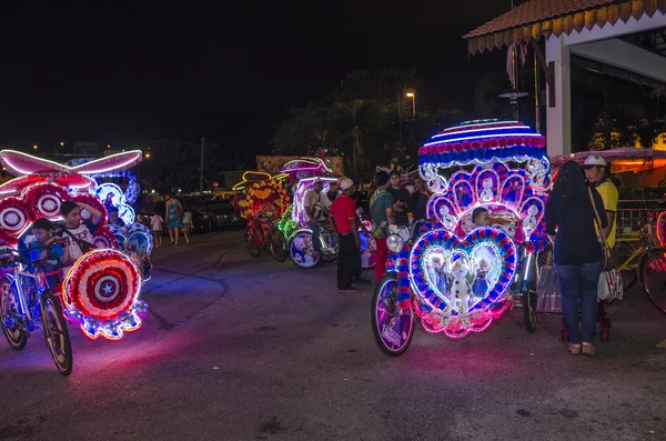 Melaka, Malaysia - August 1,2015: Decorated trishaw with colorful flowers and doll for hire at Malacca city, Malaysia. — Stock Photo, Image