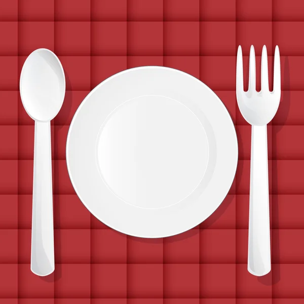 Empty green plate with knife, fork and spoon isolated on black b