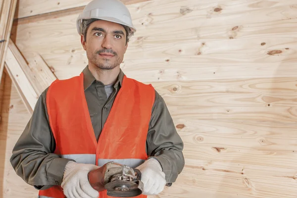 Contractor operating a power tool — Stock Photo, Image