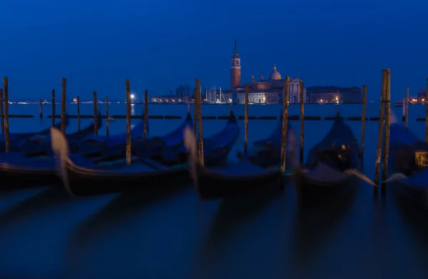 Traditional gondolas with the bell tower — Stock Photo, Image